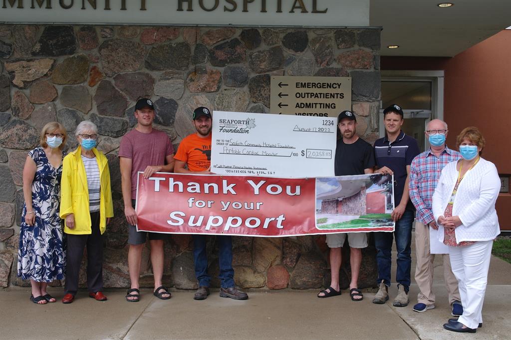 Cheque presentation in front of the Seaforth Community Hospital